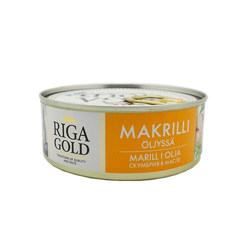 A can of Riga Gold mackerel in oil with an orange and white label, featuring multilingual text and images of fish. Cylindrical metal can with a pull tab lid, glossy surface finish. The label uses bold sans-serif and serif typefaces in black and gold. No people or hands visible. The background is a plain white studio setting in a centered product shot.