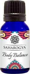 A blue bottle labeled Saharogya Body Balance with a black cap and decorative ayurvedic-inspired colorful patterns on the label. The bottle is cylindrical with a glossy surface finish. Text on the label uses clean, modern sans-serif typography. The photo is a product-only studio shot on a plain white background. No people or hands are visible.