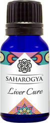 A blue glass bottle with a glossy surface, cylindrical in shape, and topped with a black ribbed plastic cap. The front label reads “Saharogya Liver Cure” in bold sans-serif type and displays geometric decorative patterns. No other objects, people, or hands are present. Image shot against a plain white background. A blue glass bottle labeled Saharogya Liver Cure features decorative patterns on the label and a black ribbed cap, emphasizing its liver care benefits.