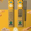 Two boxes of Ullas Orgánico Frank Incense sticks are displayed, with one open to reveal the aromatic incense sticks inside. Boxes are rectangular with a matte finish in light brown and green colors, featuring product name in bold sans serif font. Decorative frankincense resin pieces and circular certification icons appear on packaging and as photo accents. Plain background; no people present.