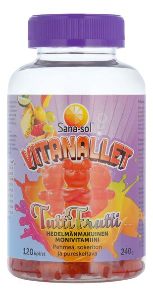 A bottle of Sana-sol Vitanallet Tutti Frutti multivitamin gummies, featuring colorful fruit images and a large orange gummy bear illustration on the label, which is in Finnish. The bottle is clear plastic with a purple, ribbed plastic cap. The label uses bold sans-serif typography and includes numbers “120” and “240g”. There are no people or hands visible. The shot is front-facing with a plain background.