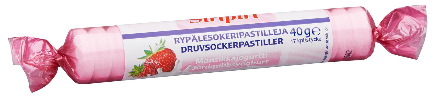 Siripiri Glukoosipastilli Mansikkajogurtti, mansikka-jogurttimakuisten glukoosipastillien rulla vaaleanpunaisessa ja valkoisessa kiiltävässä pakkauksessa, etiketissä painettu mansikkakuva; pakkaus sylinterimäinen; tuotenimi luettavissa lihavoiduin kirjaimin, mukana pienempää lisätekstiä; pinta sileä, ei ihmisiä eikä käsiä näkyvissä, tausta yksinkertainen.