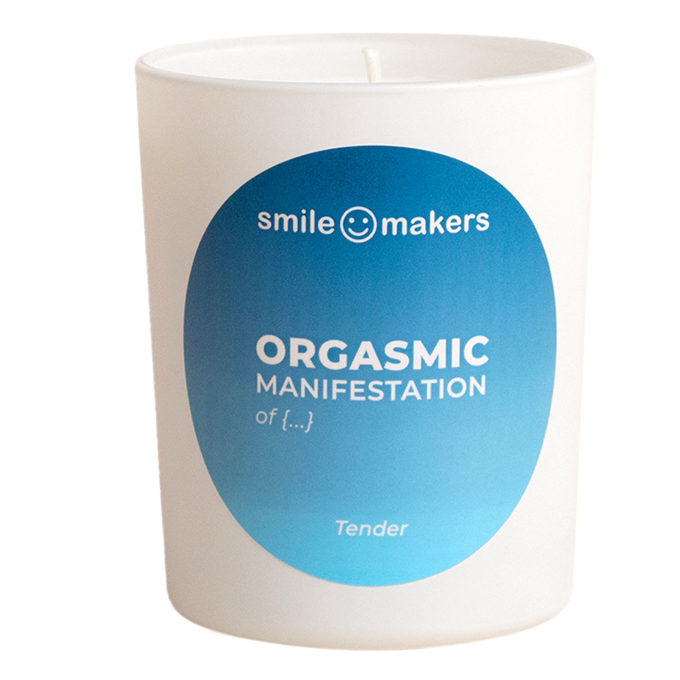 A white candle with cylindrical shape and a smooth matte surface sits upright. The blue label displays sans serif text: “smile makers and Tender” plus “ORGASMIC MANIFESTATION of pleasure.” There is no lid or visible packaging. The candle’s wick is intact and unburned. The background is plain, with neutral lighting. No people or other objects are present.