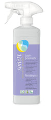 A white spray bottle of Sonett ecological glass cleaner with a light purple label featuring biodegradable ingredients and product details in multiple languages. The bottle is plastic with a matte surface and has a curved ergonomic shape. The label has sans-serif text in various font sizes, with smaller multilingual text blocks. No people or hands are visible. The image background is plain white, photographed from the front.