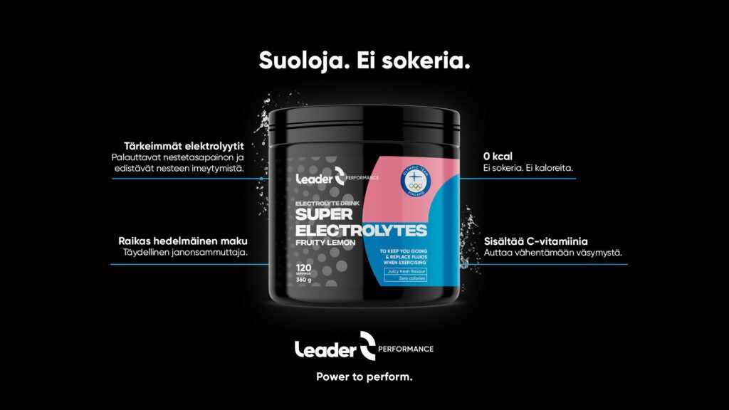 Black cylindrical container of Leader Super Electrolytes, matte finish, label with Finnish text listing no sugar, 0 kcal, vitamin C, fruity lemon flavor, and electrolytes. Typography is bold in white and blue on black. No people or actions shown. Background is solid black. Product shot is front-facing.