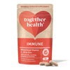 A red and beige pouch of Together Health Immune supplements, labeled with vitamin C, D3, and Zinc. The pouch is soft-sided with a matte finish and rounded corners. Bold sans-serif text is used for product information on the front. Three tan capsules are placed in front of the pouch on a white background. The package mentions 30 capsules and natural ingredients for immune support.