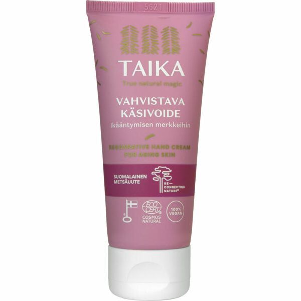 A pink tube of Taika hand cream labeled “Vahvistava Käsivoide for aging skin” is shown, made of soft matte plastic with a screw cap. The label includes icons for vegan, cruelty-free, no microplastics, and Cosmos Natural certification. Typography is white and sans serif. The background is plain white. No people or hands are present in the shot.