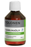 A brown plastic bottle with rounded shoulders and a glossy finish, topped with a flat white screw cap. The front label features “Tolonen Camelinaöljy” in bold black text and additional Finnish wording in smaller fonts. A small Finnish flag logo is on the right of the label. Background is plain white; no people or hands visible.