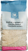 A 1 kg bag of Urtekram coarse Atlantic sea salt with multilingual labeling in Danish, Norwegian, and Finnish. The unrefined sea salt is visible through a transparent plastic bag sealed with a blue matte-finish top. The label uses sans serif font with dark text on a white background. Product rests against a plain white backdrop; no people or extra objects are present.