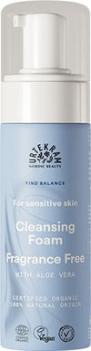 A blue bottle of Urtekram Cleansing Foam for sensitive skin, fragrance free with aloe vera and organic certification, featuring a convenient pump dispenser. The plastic bottle has a matte finish, cylindrical shape, and white pump. Simple sans-serif label text printed mainly in white and light blue. Plain white background, no people or objects visible, close-up product shot.