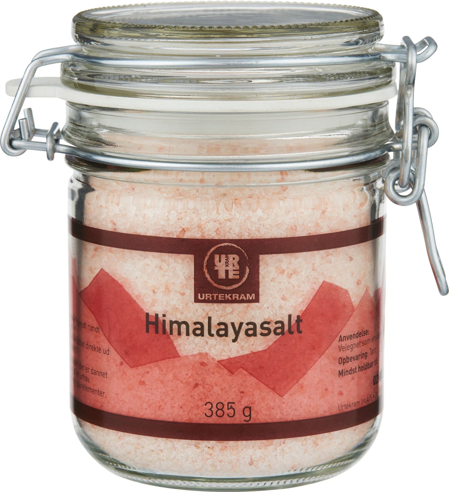 A glass jar of Urtekram Himalayan salt with a metal clasp lid. The jar is cylindrical and transparent, showing pink salt crystals inside. The label has pink and red colors, displays the brand name “Urtekram,” and notes a net weight of 385 grams. Typography is clean and sans-serif. The surface finish appears glossy. No people or hands are present. White background, product-centered shot.