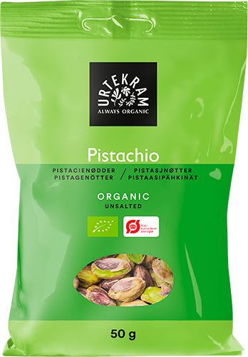 A green 50g bag of Urtekram organic unsalted pistachios, featuring images of pistachios and the word “pistachio” in multiple languages on the front. Matte finish plastic packaging, rectangular upright shape with sealed edges and a seam at the top. Front label has sans-serif black and white text. White background, no people or actions shown; front-facing product shot centered in frame.