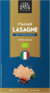 Blue package of Urtekram organic Italian lasagne sheets, labeled 100% wholegrain. Rectangular box with matte finish, features Italian flag graphic and small illustrations of tomato and basil near the lower front. Weight 250g and “about 14 wholegrain sheets” stated on front. Sans-serif typography, product photo on plain background, no people or hands visible.