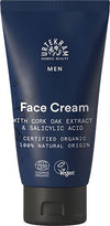 A blue squeeze tube of Urtekram Nordic Beauty Men Face Cream is shown. The tube has a matte finish with white and light green sans-serif text. The packaging is cylindrical, tapering toward the cap, which is also blue. Visible label notes cork oak extract, salicylic acid, 100% natural origin ingredients, certified organic. EcoCert and Vegan logos are present. Plain light background; no people or props.