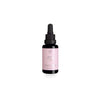 A small bottle of Arctic Beauty Oil with a pink label and a black dropper cap is placed against a white background. The bottle is cylindrical, made of clear glass with a glossy finish, and contains liquid. The pink label features the product name in bold, sans-serif typography. Packaging shows no other visible elements or accessories. No people or hands are present in the image.
