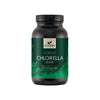 A dark cylindrical jar with a matte finish, labeled “Foodin Korean Chlorella Jauhe.” The label features green accents and leaf illustrations, with bold sans-serif text. The jar appears plastic and opaque. No people or hands are visible. The background is plain and neutral. A dark jar labeled Foodin Korean Chlorella Jauhe with green accents and leaf designs, containing nutrient-rich chlorella powder.