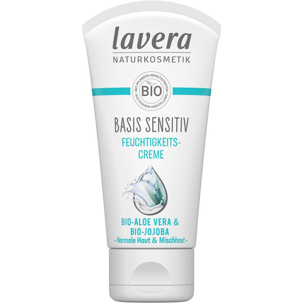 A white tube of Lavera Basis Sensitiv Feuchtigkeitscreme with nourishing aloe vera and jojoba for normal and combination skin. Rectangular soft plastic tube with a semi-matte finish; blue and grey accent graphics; upright orientation; clear sans-serif label text in black and blue; flat white cap at bottom. Plain, light background. No people or hands visible. Studio-style product shot.
