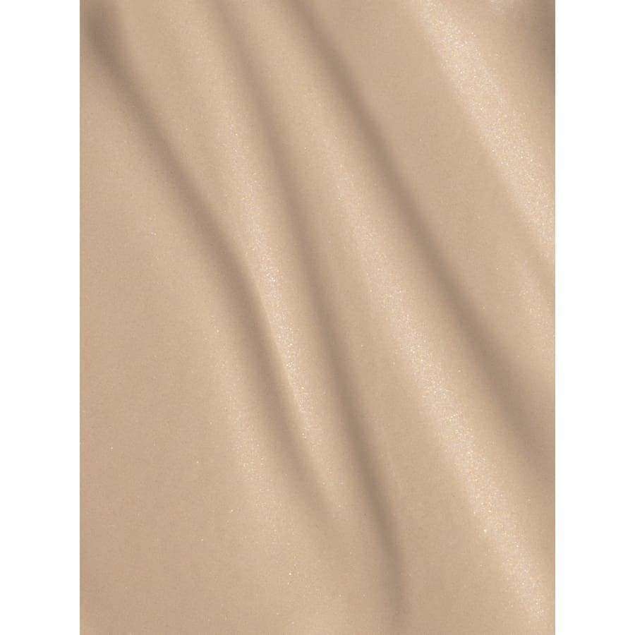 Beige, slightly shimmery linen with soft, diagonal folds and a smooth texture. Rectangular fabric section displayed loosely draped. No visible packaging or label. Plain background, product fills frame. No people or hands present. Studio lighting highlights the material’s surface finish and texture detail.