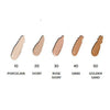 Five foundation swatches labeled: 10 Porcelain, 20 Ivory, 30 Rose Ivory, 40 Sand, and 50 Golden Sand are arranged from lightest to darkest shade left to right on a flat surface. Swatches have a creamy texture with a subtle sheen. Labels use clear sans-serif font printed below each swatch. Background is plain white with no visible people or hands. Medium-close shot.