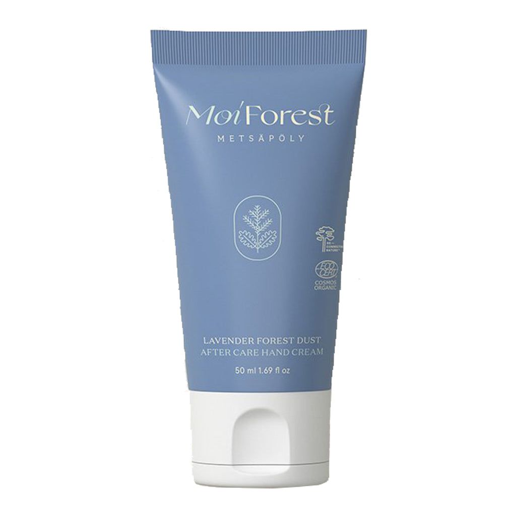 A blue, matte-finish squeezable tube with a flip-cap shows white sans-serif text and a small line drawing of a plant on the front. The label reads: Moi Forest Lavender Forest Dust After Care Hand Cream, 50 ml. Background is plain and neutral. No people or hands are present in the image. A blue tube labeled Moi Forest Lavender Forest Dust After Care Hand Cream, 50 ml, with white text and a small plant illustration on the front features soothing lavender extract.