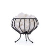 A decorative black metal bowl with curved legs holds several large, white quartz crystals against a white background. The bowl has a matte finish and no visible patterns or labels. The curved legs raise the container above the surface. No packaging, text, or branding is visible in the image. The angle is straight-on with even lighting; there are no people or props included.