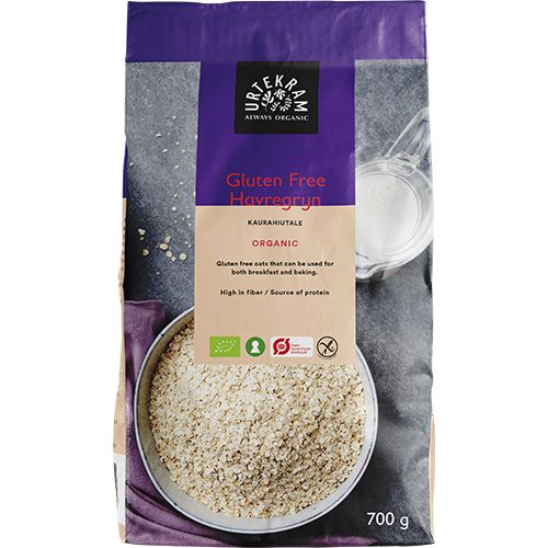 Urtekram Gluteeniton Luomu Kaurahiutale -pussi, 700 g, vihreä, kuva kaurapuurokulhosta ja maitolasista; mattapintainen pussi, musta-valkoinen groteskiteksti, korkea kuitupitoisuus ja proteiinilähde mainittu